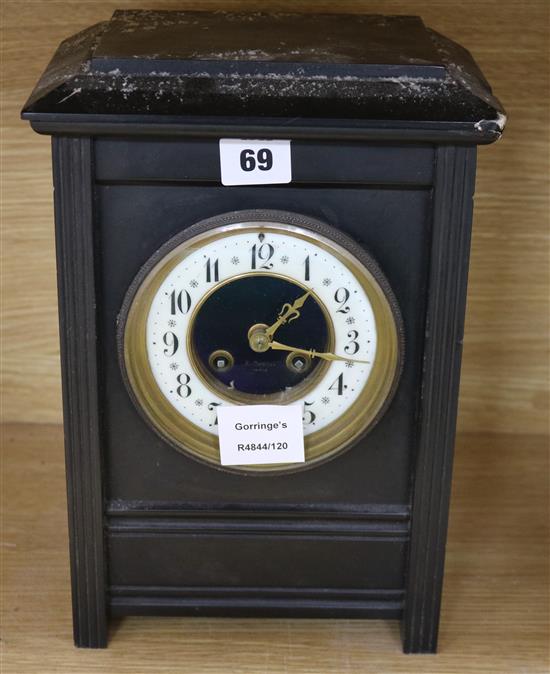 A Victorian black slate mantel clock